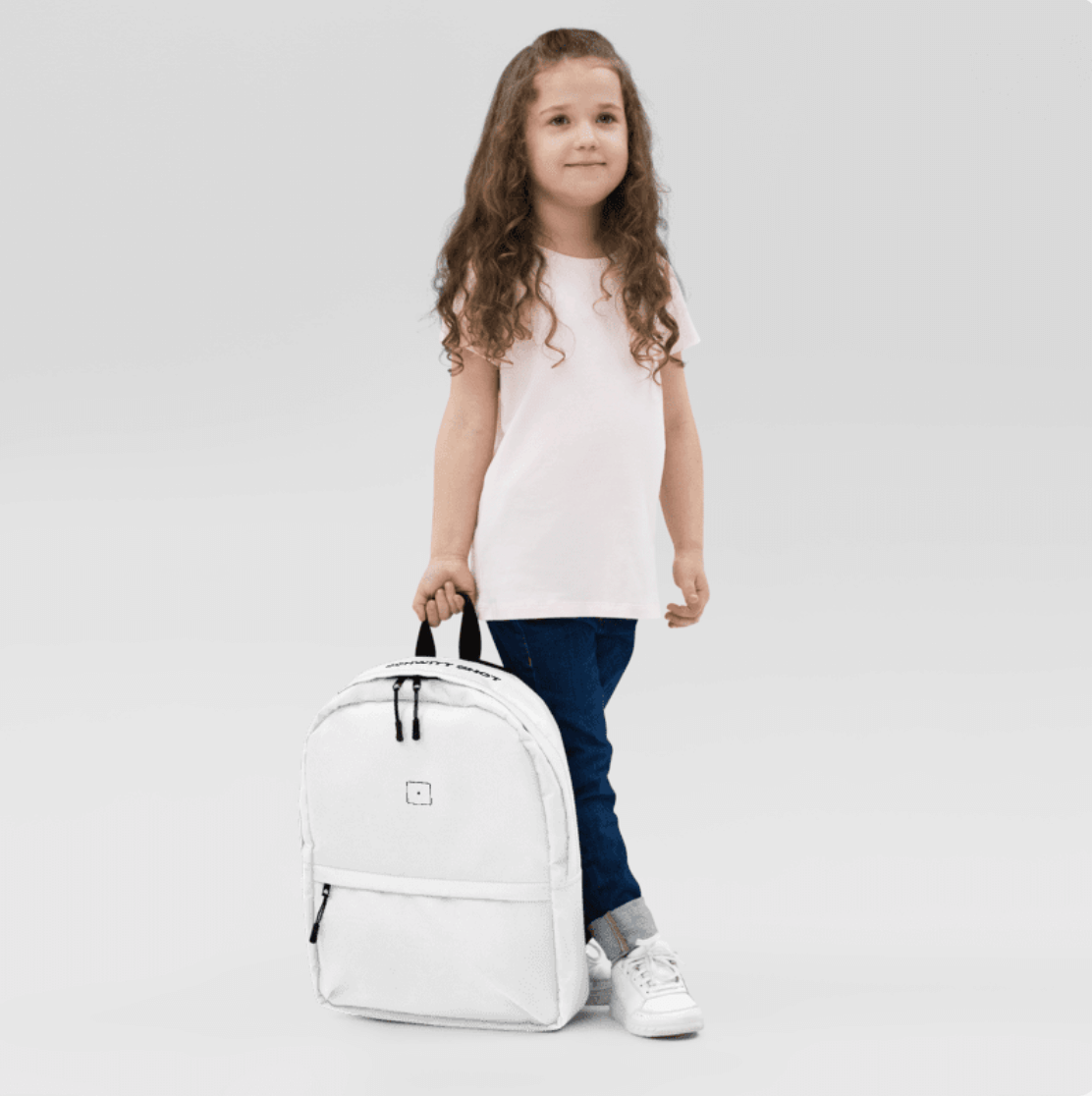 SCHWITT SHOT Black Label Ultra Premium Backpack White held by a child