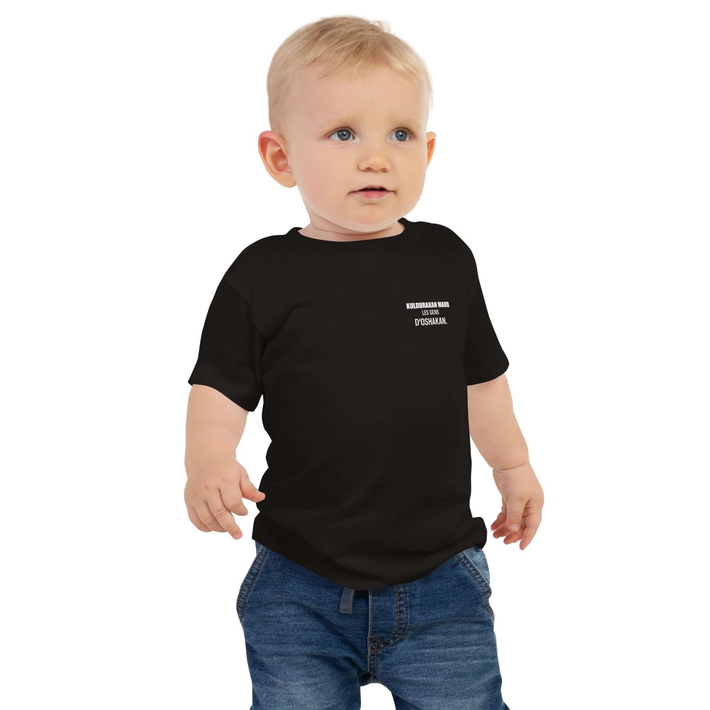 Toddler wearing black 'KULDURAKAN MARD' t-shirt with white text, showcasing cultural roots and style.