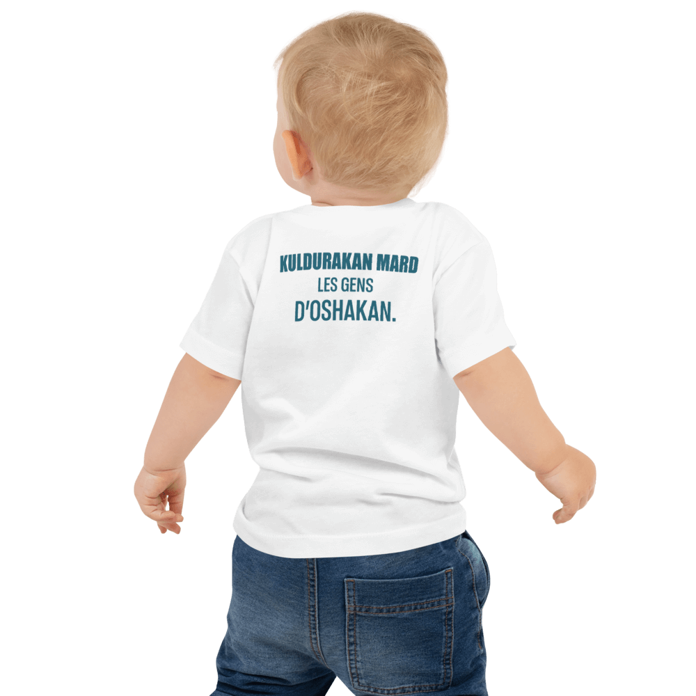 Toddler wearing a white KULDURAKAN MARD t-shirt featuring 'Les Gens d'Oshakan' text on the back.