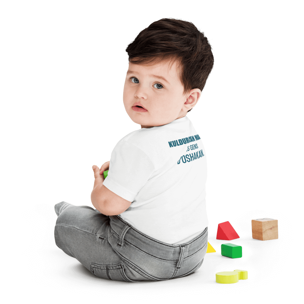 Toddler wearing a white KULDURAKAN MARD t-shirt featuring 'Les Gens d'Oshakan' from the back.